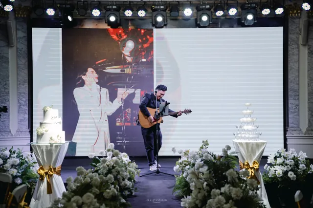 An acoustic performance on a celebration stage