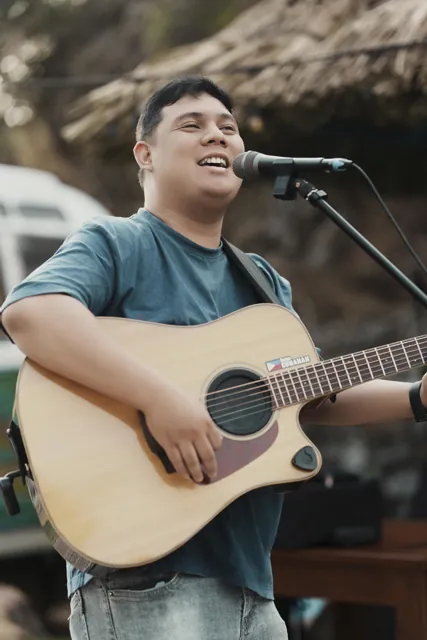 Ralph singing during an outdoor acoustic set